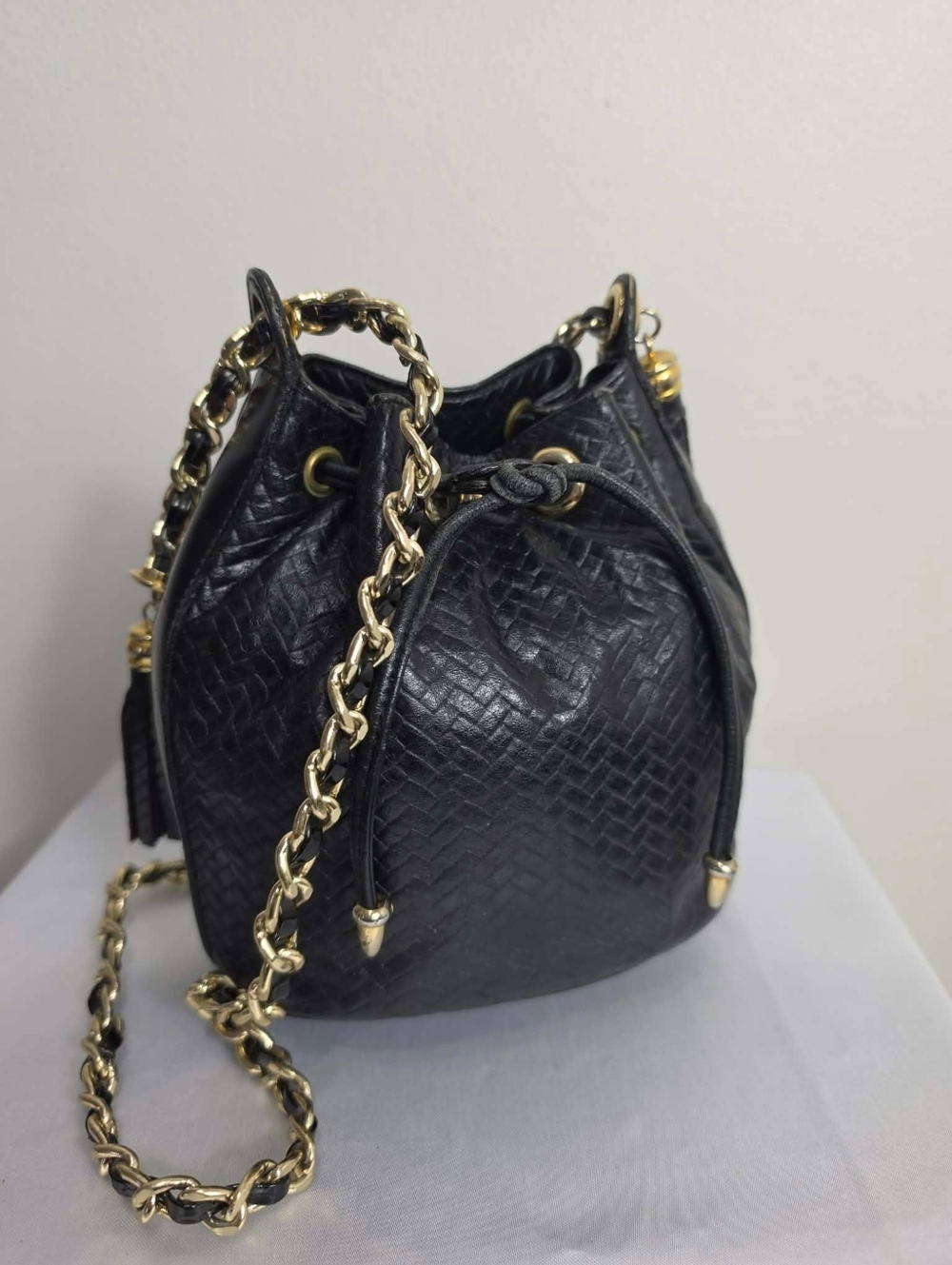 Black Textured Leather Drawstring Bucket Bag with Gold Chain